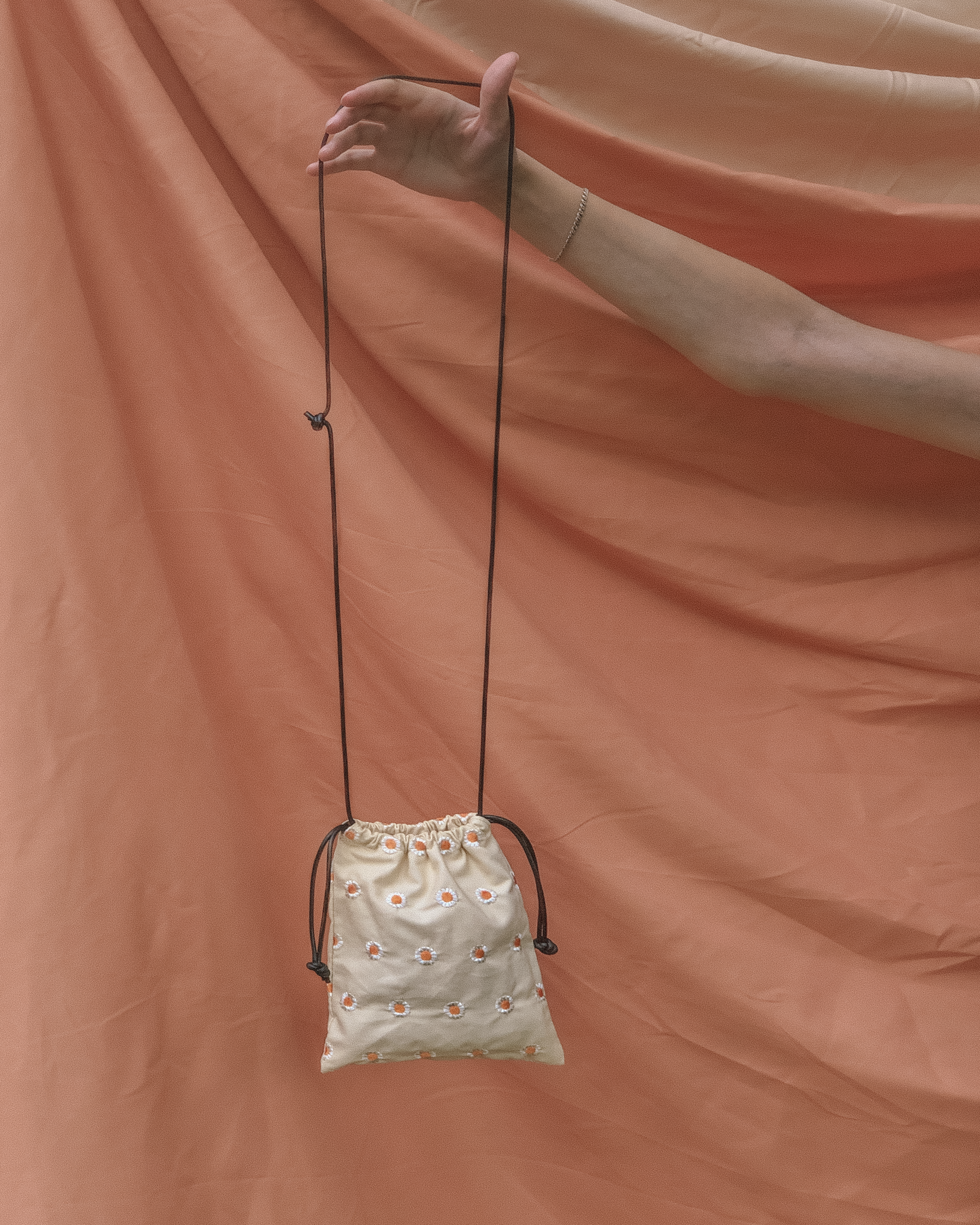 Daisy Drawstring Sling Bag  by Veronique