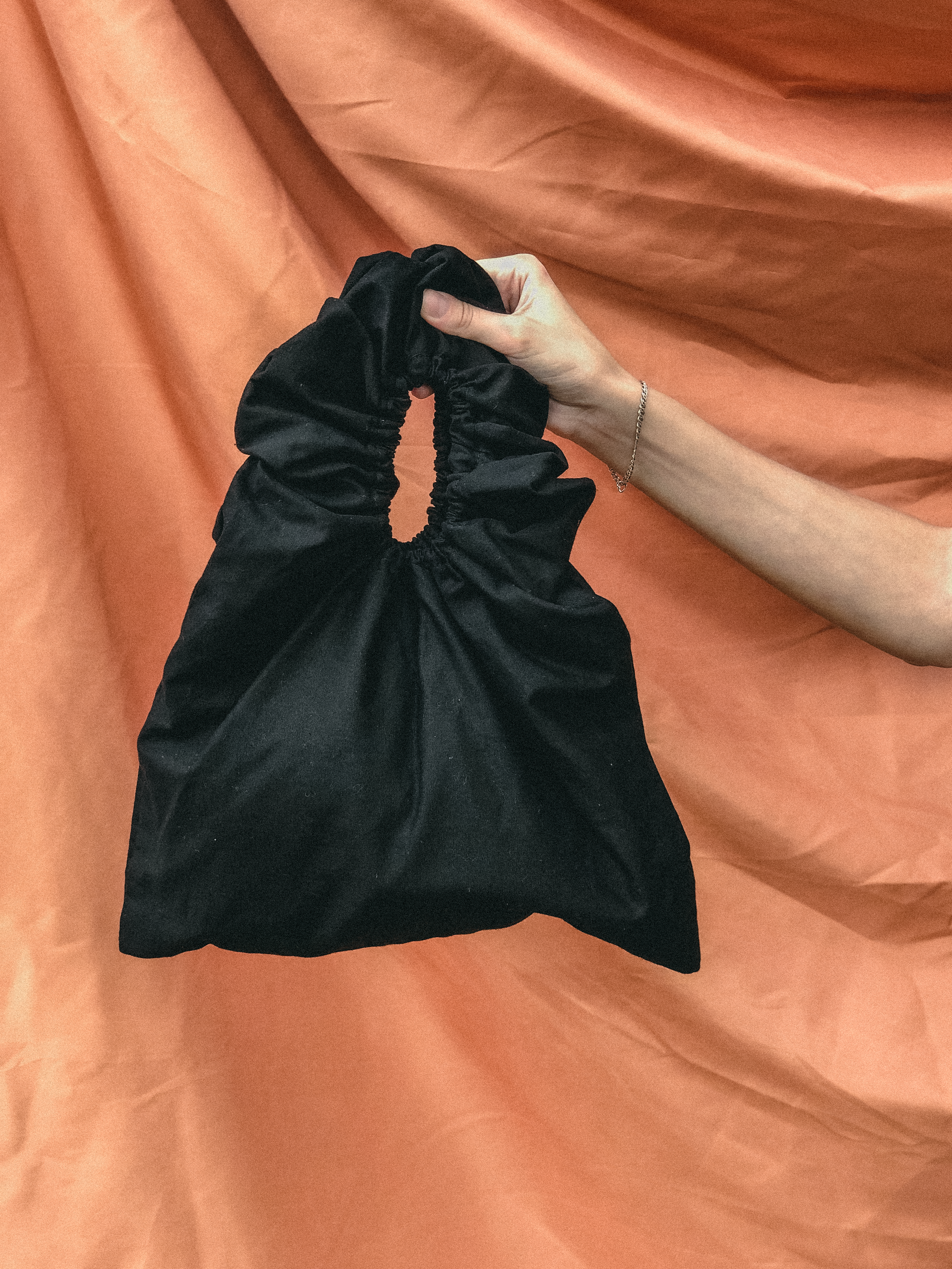 Dumpling Bag in Black by Veronique